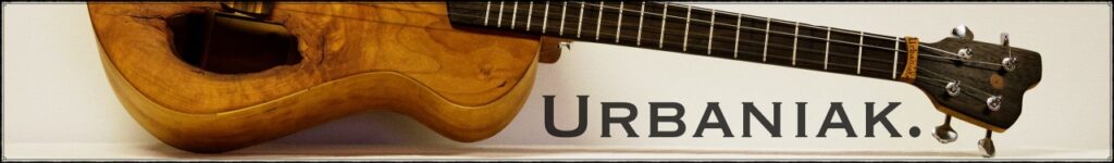 Half showing baritone ukulele with Urbaniak