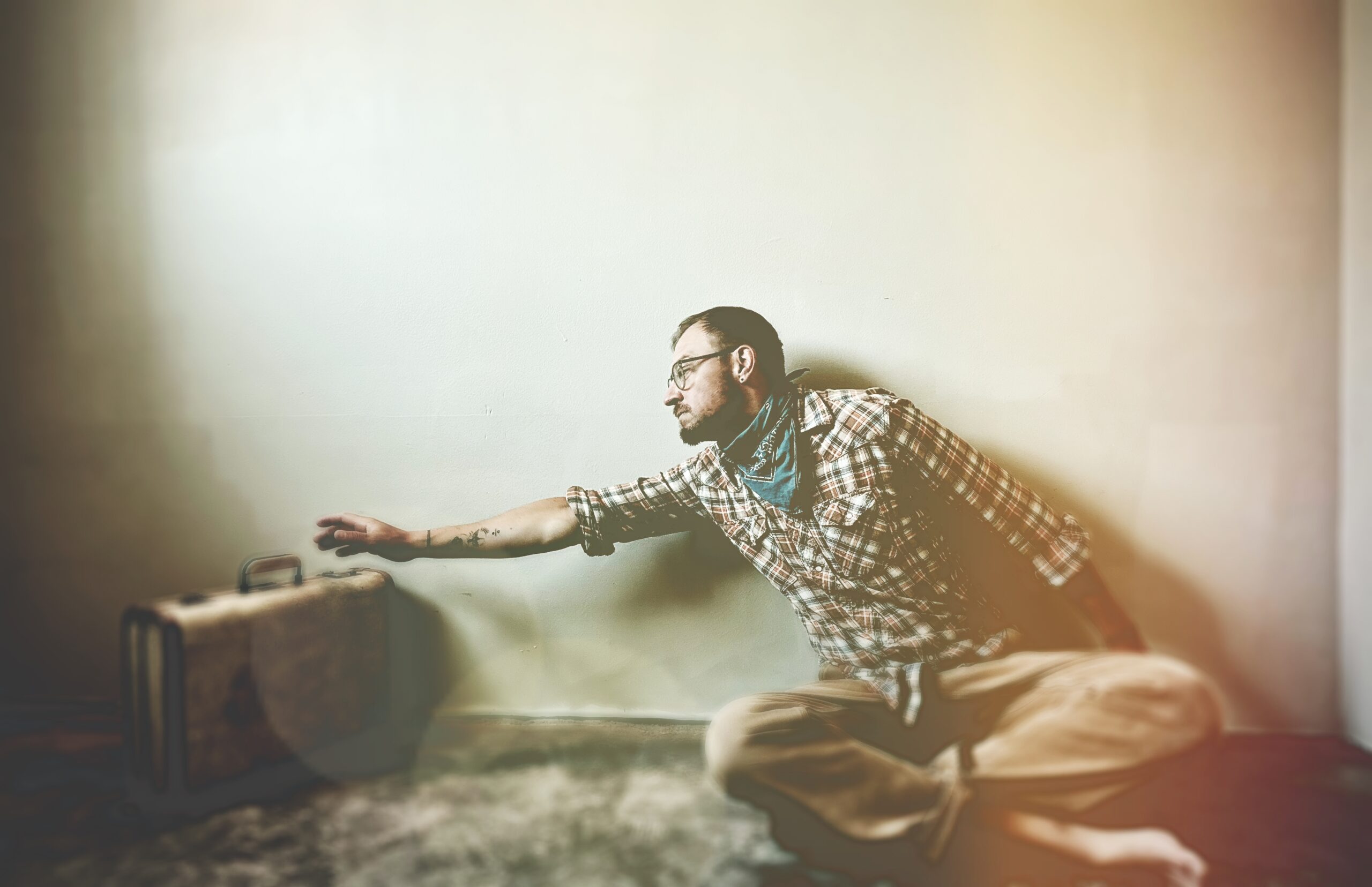 Reaching for a suitcase